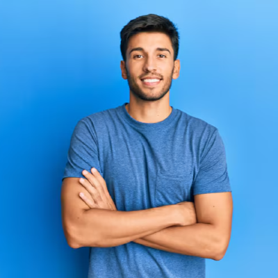 ff 72b5e49c940b459f24f158b89d8da49c ff young handsome man wearing casual tshirt blue background happy face smiling with crossed arms looking camera positive person 839833 12963